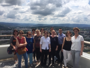 Group of smiling workshop participants and a lovely Basel view.